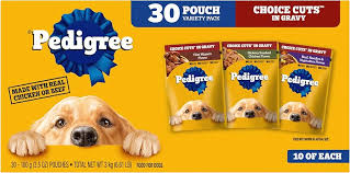 Premium pet food packaging with natural ingredients displayed.