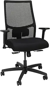 Modern wooden chair with soft gray cushion placed beside a table.